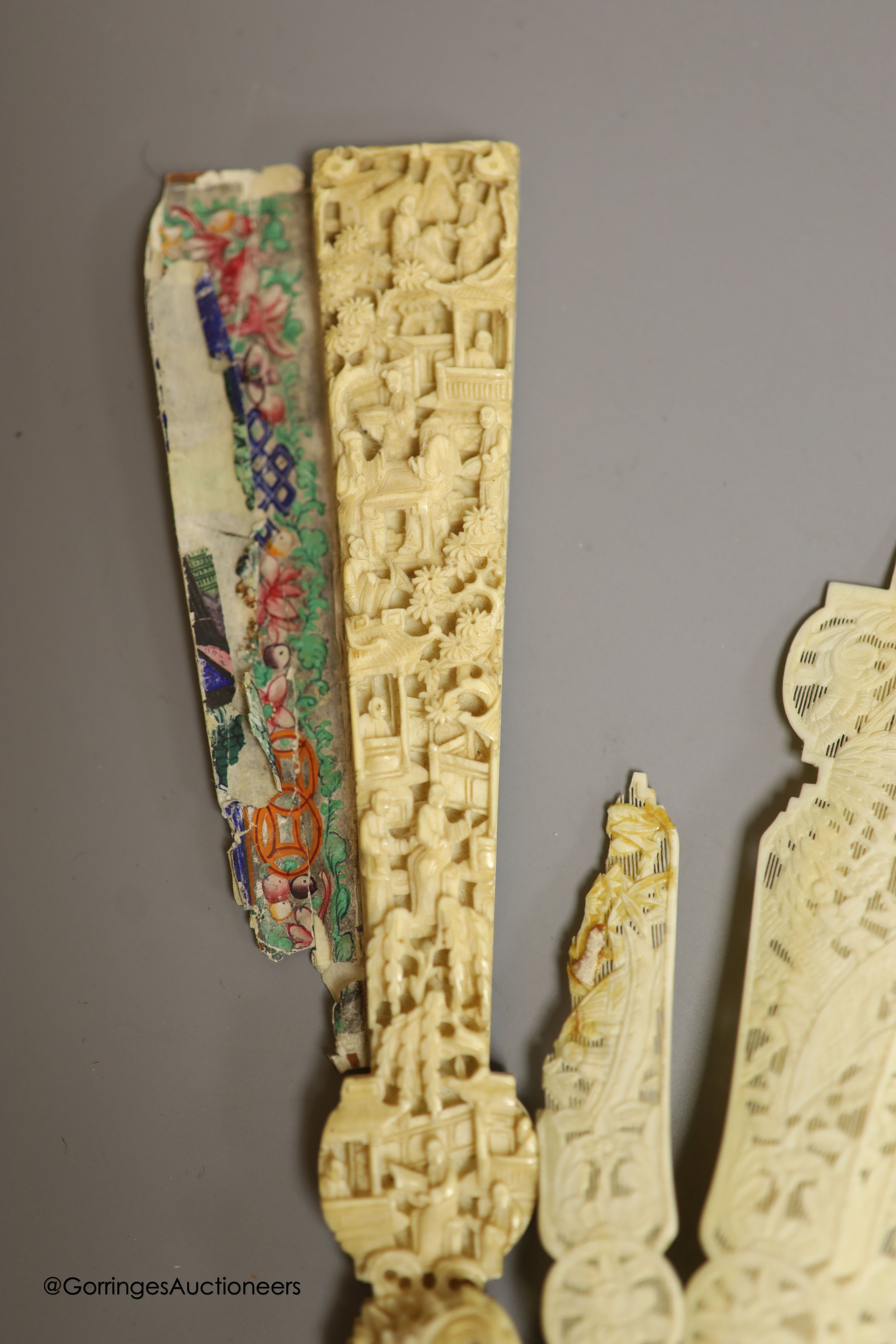 A 19th century Canton ivory and painted paper fan, in need of restoration